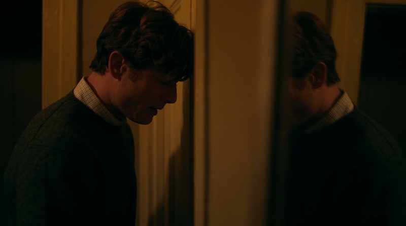 [turning door handle]