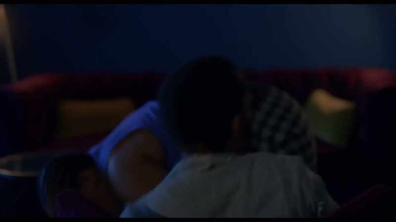 [TV blaring loudly]