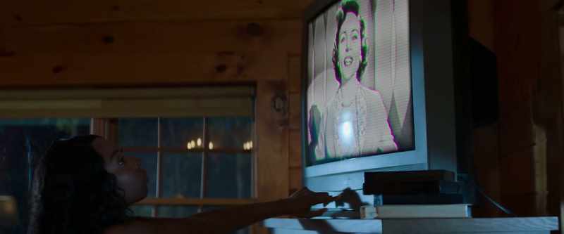 [TV crackling]