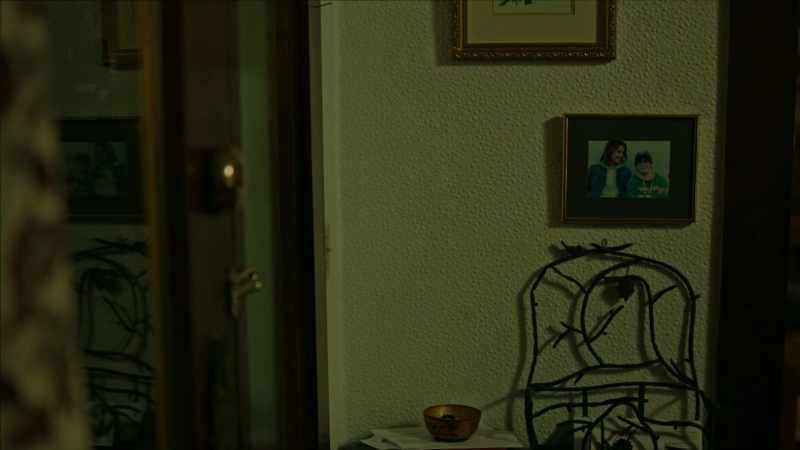 [ TV playing indistinctly ]