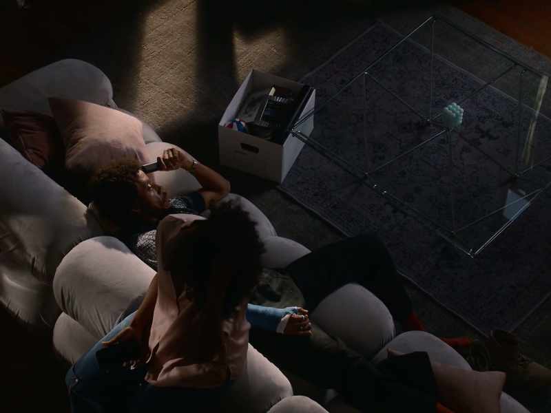 [TV playing]