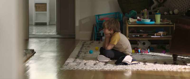 [TV playing]