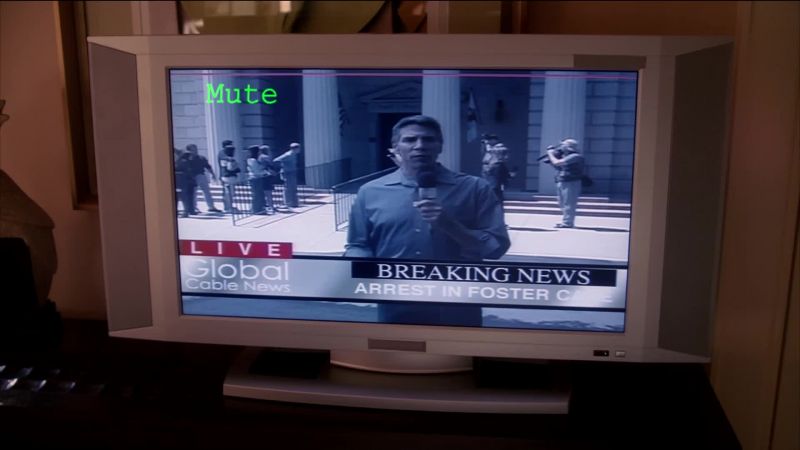 (TV sound muted)