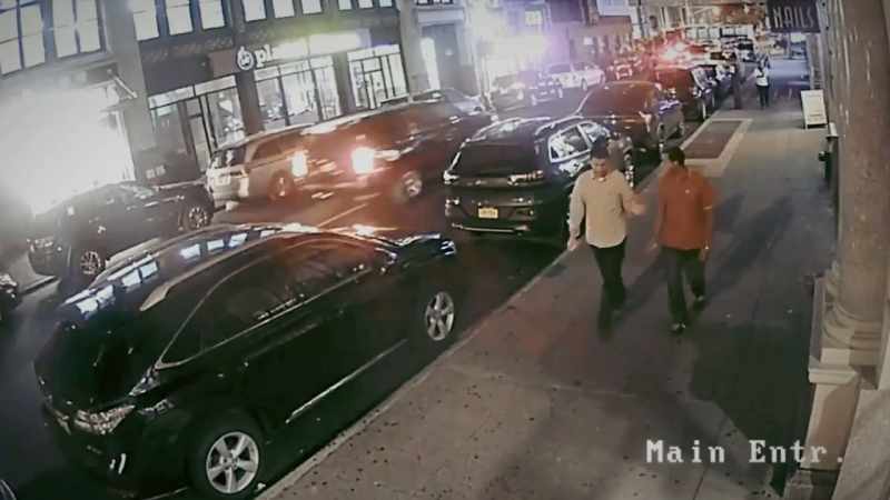 Two gentlemen walked down the street, well-dressed
