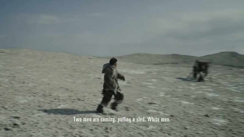 Two men are coming, pulling a sled. White men
