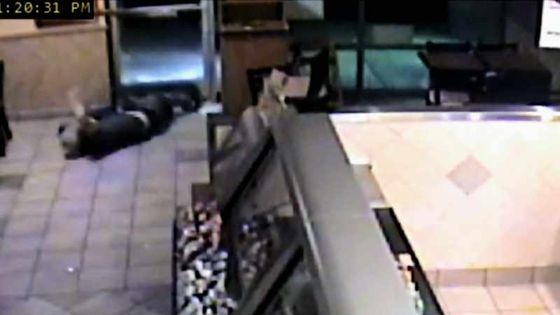 Two officers pick Jason up
