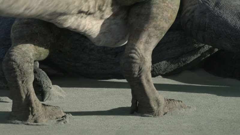 [tyrannosaur grunts, bites]