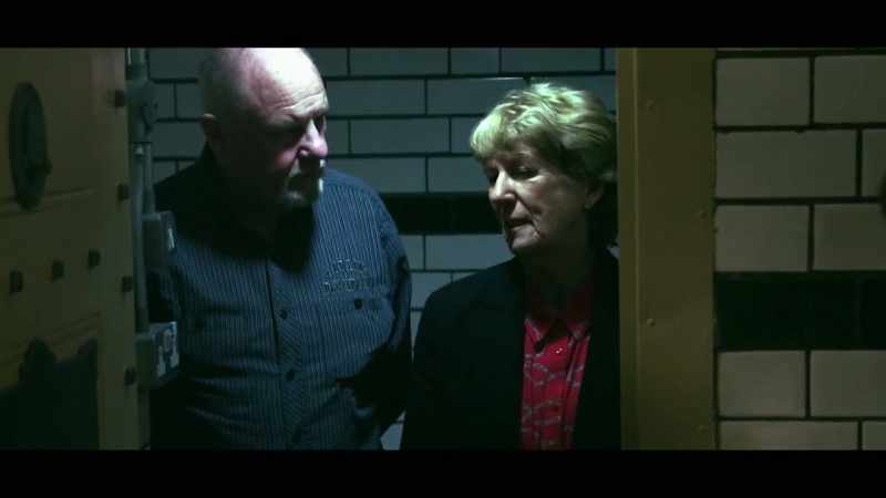 Under arrest and in detention by the police