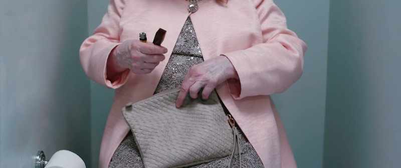 (unzips purse)