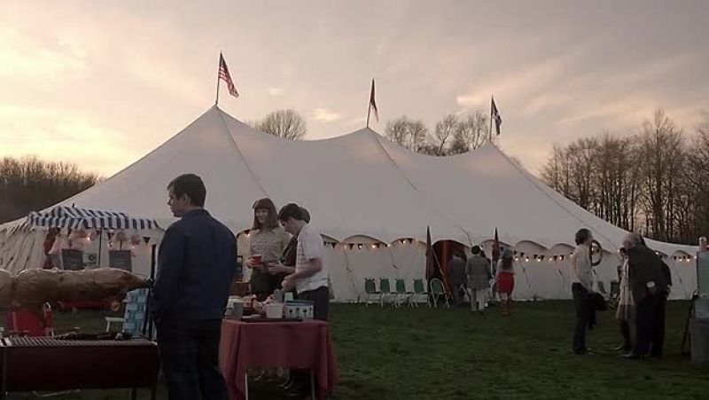 [upbeat folk music playing]