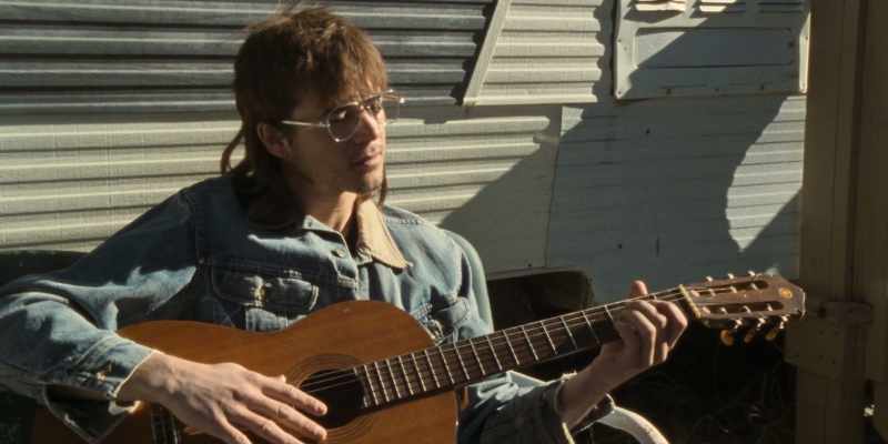 Upbeat rock music plays