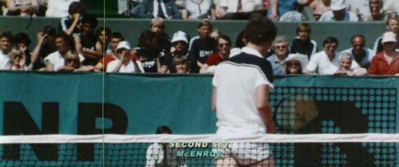 US COMMENTATOR: Game and set to McEnroe