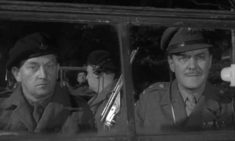 Van and rear escort stopped by traffic light, sir