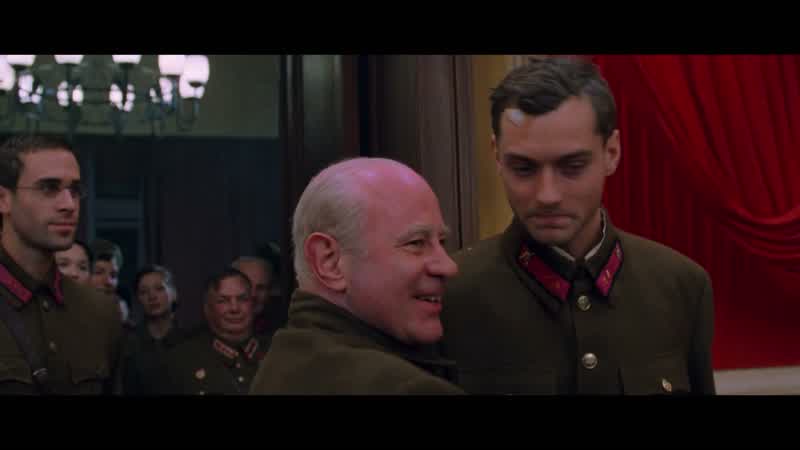 Put your cap back on you look more heroicThis way Comrade Zaitsev I love this little fellowman Vassili is it true that you volunteered for the frontHow old are you VassiliDo you know what this duel