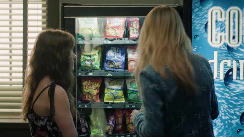 [ Vending machine beeps, thud ]