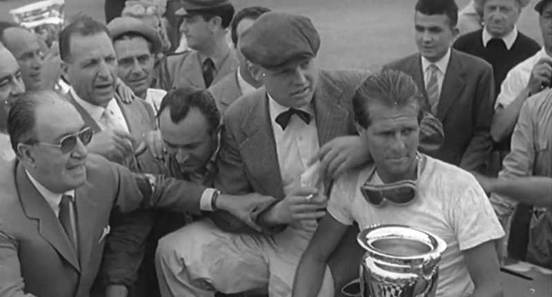 Victory goes to Peter Collins and Mike Hawthorn