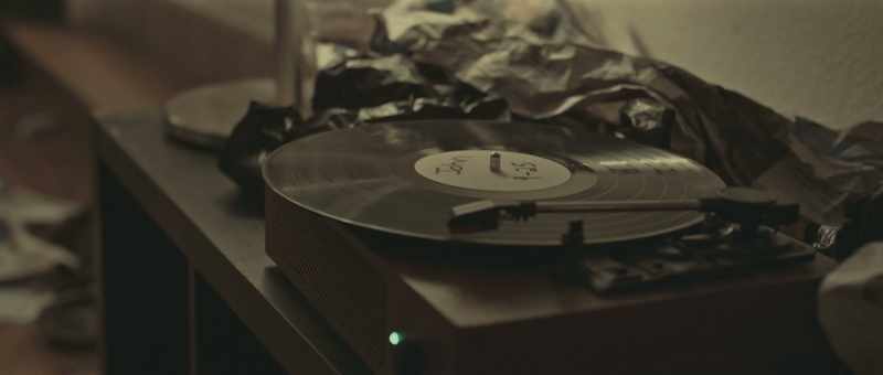 [vinyl player crackling]