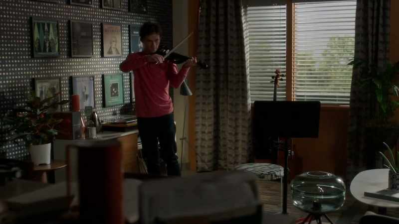 [violin music]