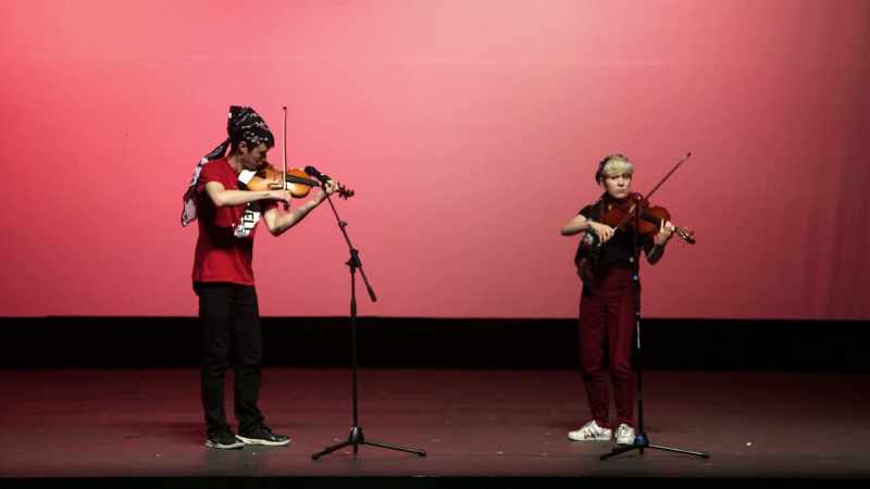 [violin music]