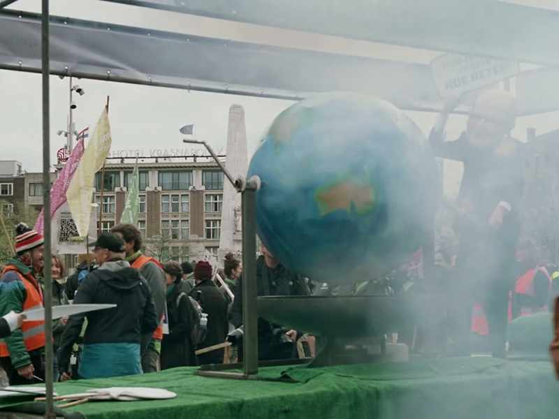 VOICE-OVER: 9 Dam Square