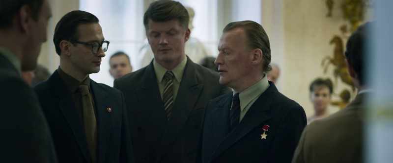 Wait. See the guy that the Russians are standing around?