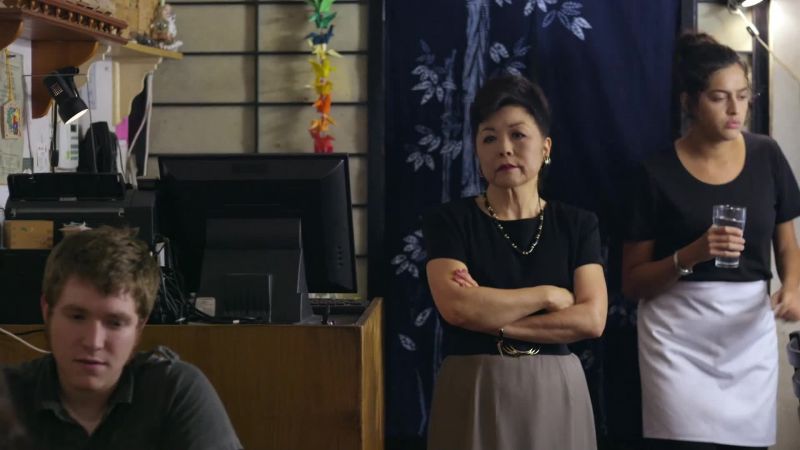 (waitress, chefs shouting in Japanese)
