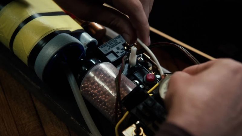 (watch mechanism clicking)