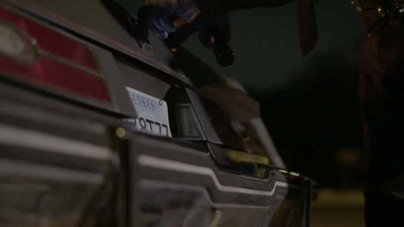 Watching them open the trunk of her car