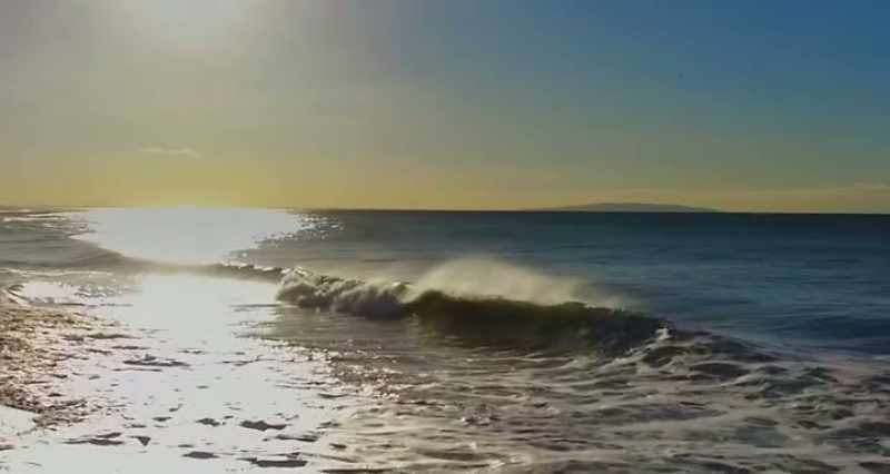 (waves rushing)