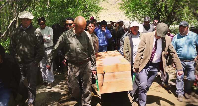 We lowered his coffin into the grave