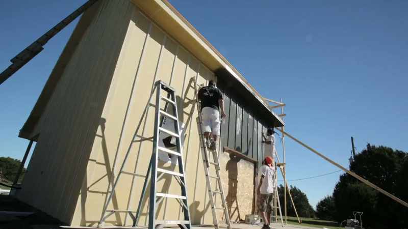 We put up all the new siding, painted it a sleek, dark gray