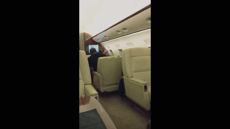 We sit him in a chair on the plane