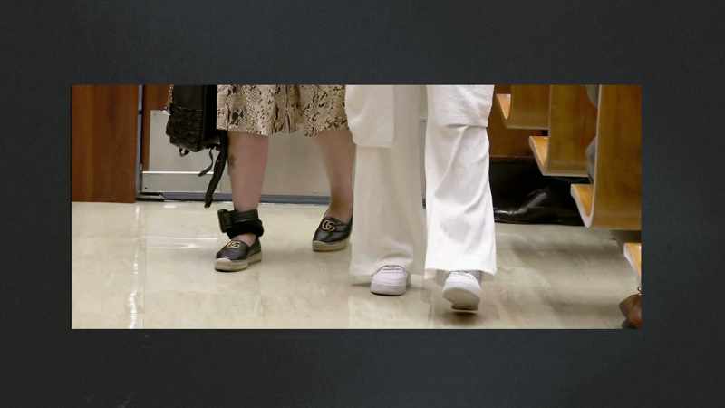Wearing ankle monitors, the mother and daughter
