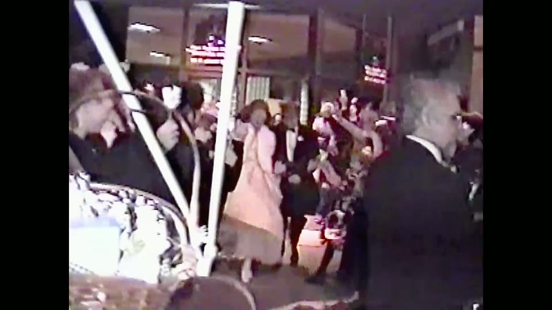 (wedding goers cheering)