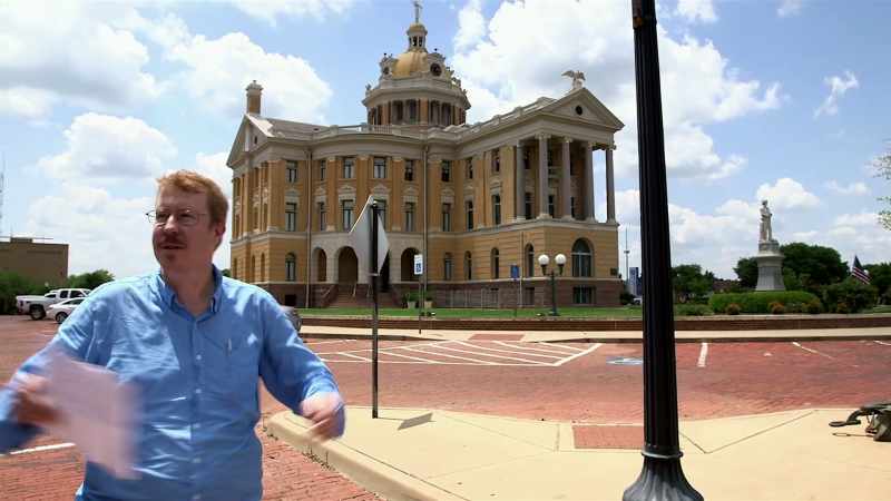 WELL, HERE WE ARE AT THE COURTHOUSE