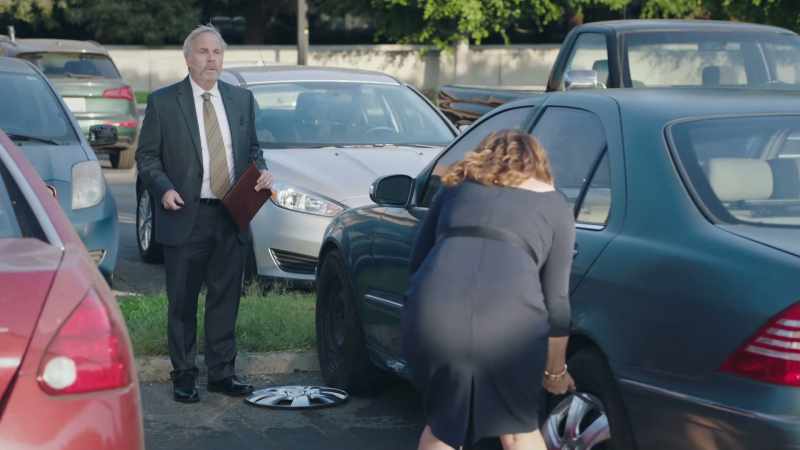 What are you doing to my car? - I'm stealing your hubcaps