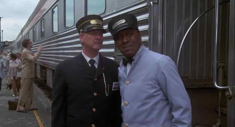 What are those conventioneers doing up at the baggage car?
