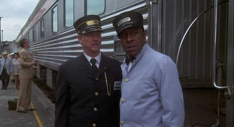 What are those conventioneers doing up at the baggage car