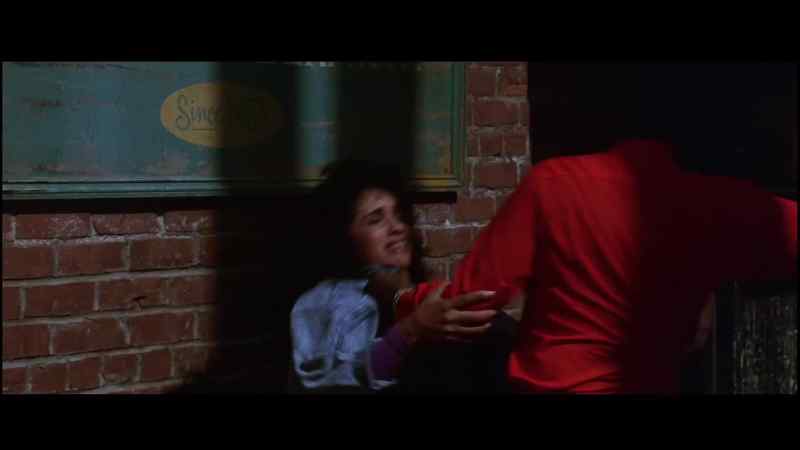 What's he doing? He's beating this girl