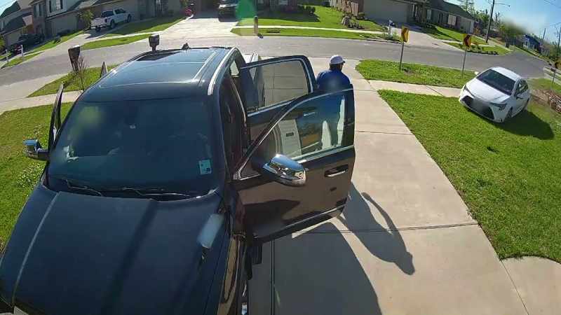 � While cleanig his truck in his driveway
