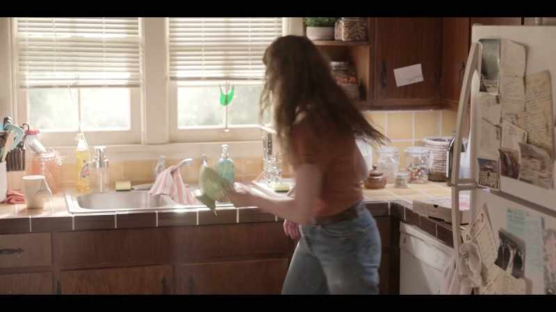 Who would put a colander in the fridge with one grape in it?