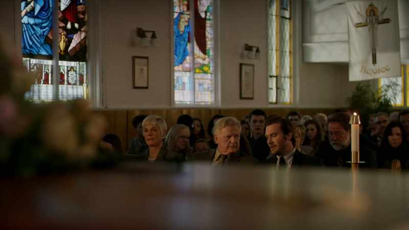 Who's that woman sitting next to Henry Masters?