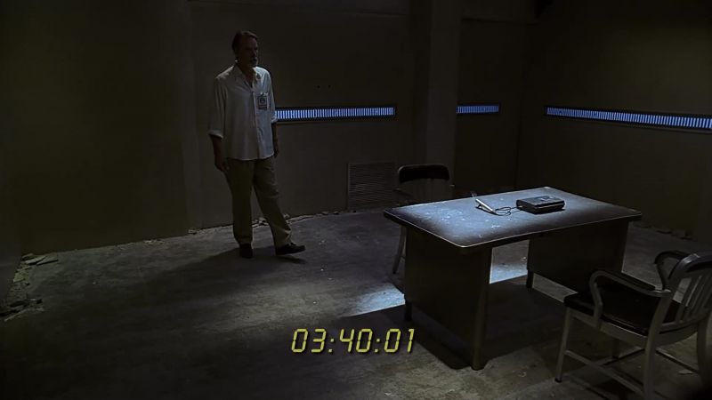 Why have I been kept waiting here like this? - Sit down, please, Mr Warner