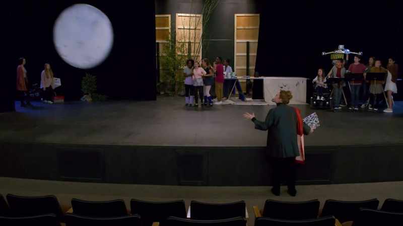 Why is there a moon swinging by Tinsley's face?