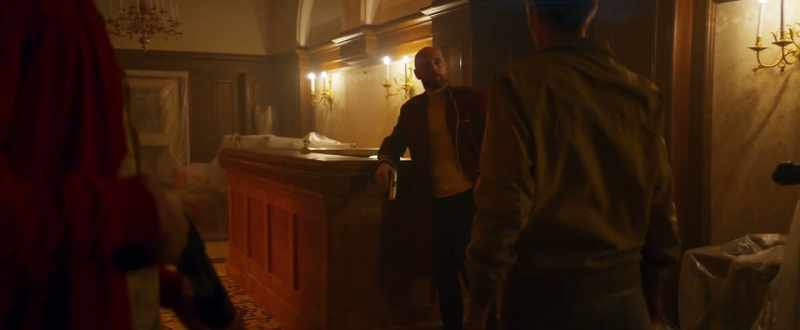 Why would a decorated officer hole up here as a doorman?