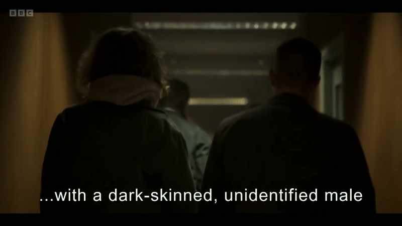 with a dark-skinned, unidentified male