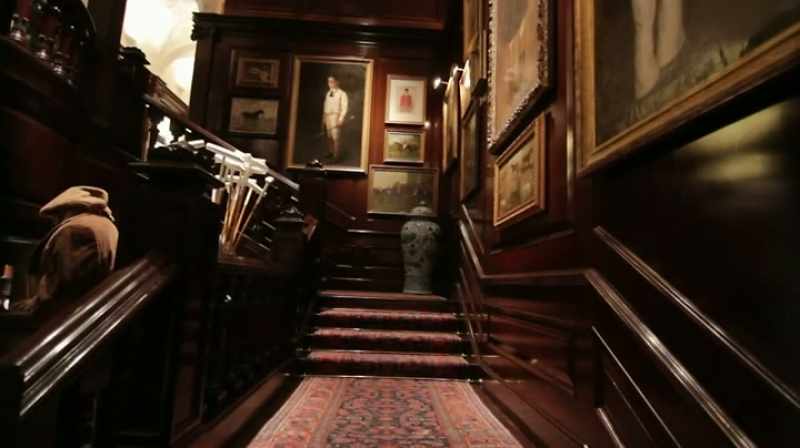 With a grand staircase, Oriental carpet