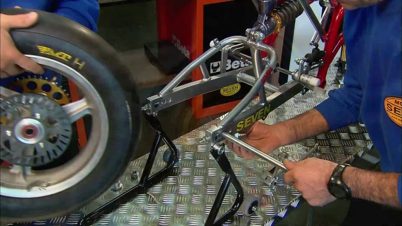 WITH A STEEL PIN, THEY MOUNT A WHEEL ON EACH FORK