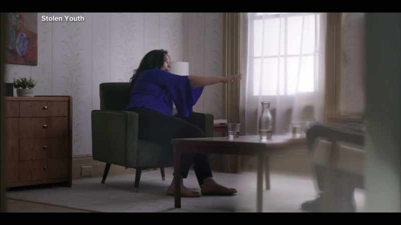 with her hand on Larry's genitals