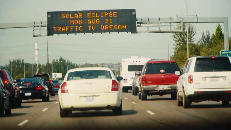 WOMAN [ON RADIO]: Additional delays are expected due to eclipse-related traffic
